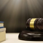 Judges gavel and book on wooden table. Law and justice concept b